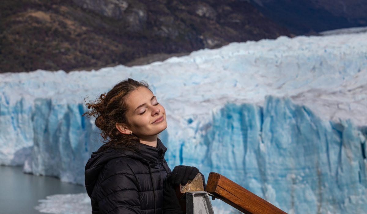 16 years old girl enjoying holidays at Glaciar Perito Moreno - Patagonia